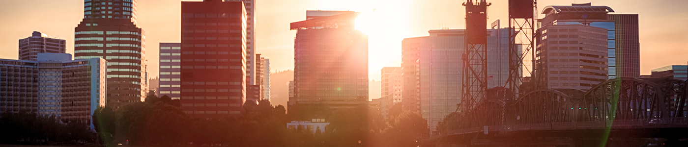Tualatin Oregon skyline with sun peaking through the buildings